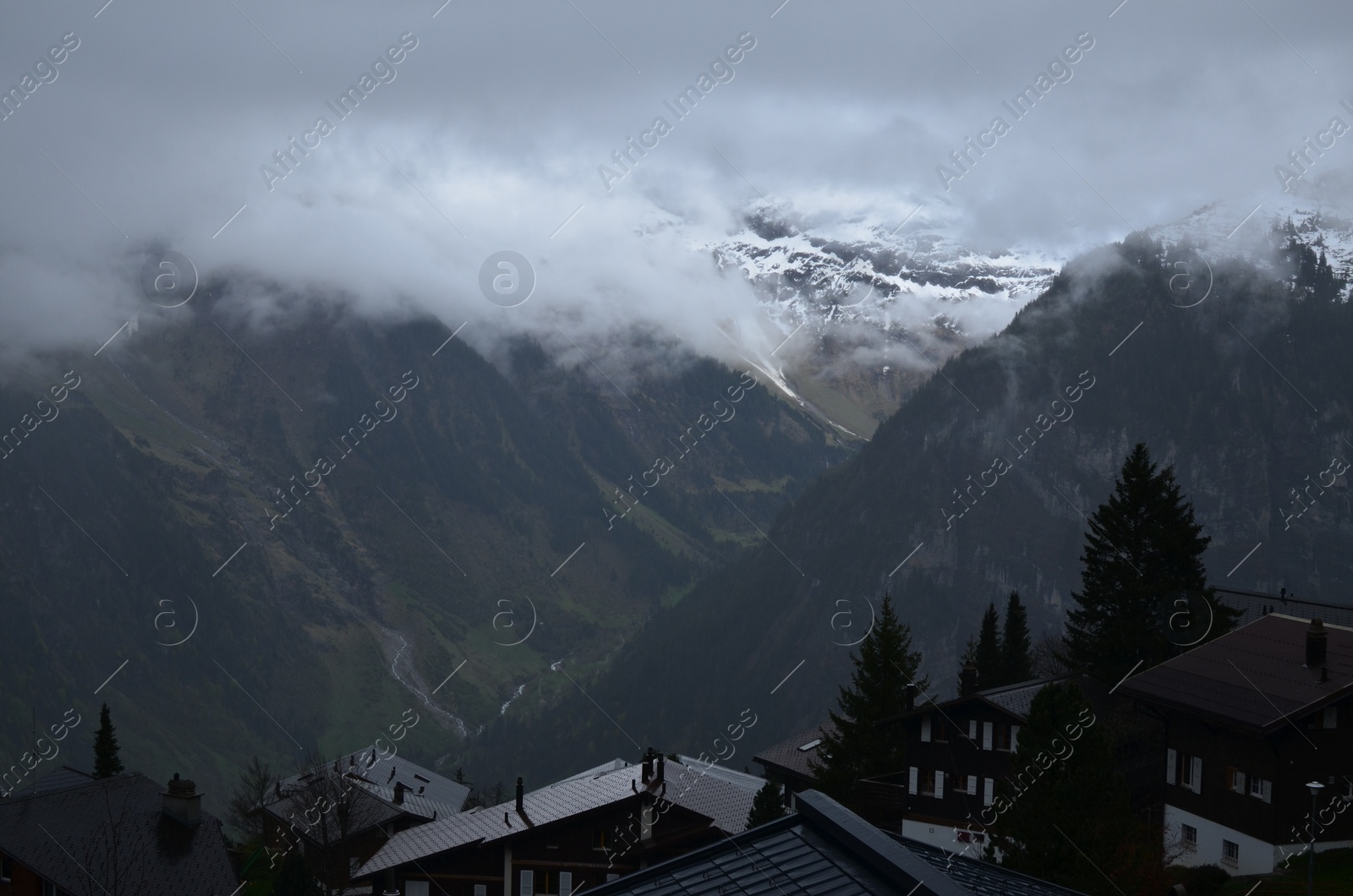 Photo of Picturesque view on cottage village and mountains