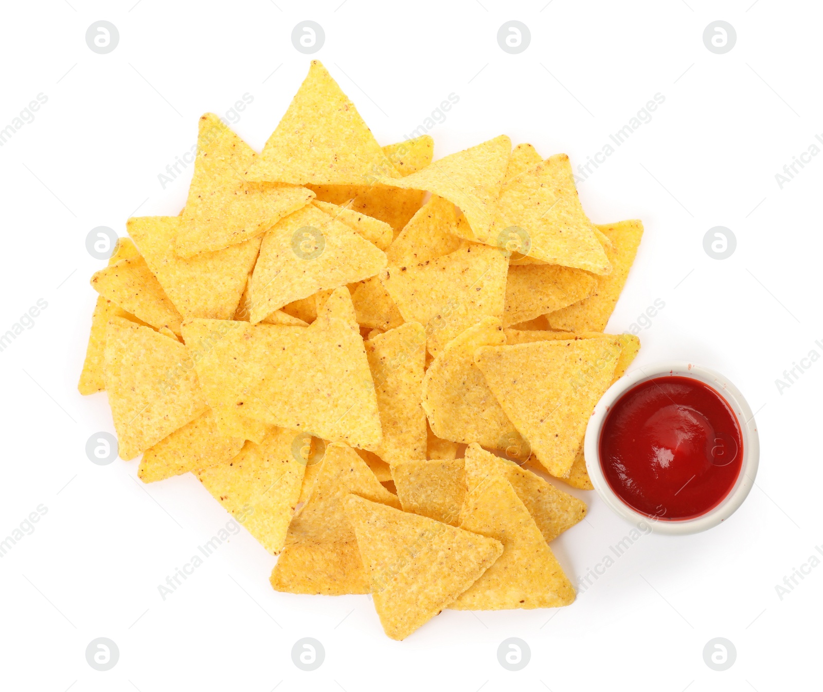 Photo of Tasty tortilla chips with ketchup on white background, top view