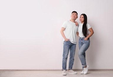 Photo of Portrait of happy couple on white background, space for text