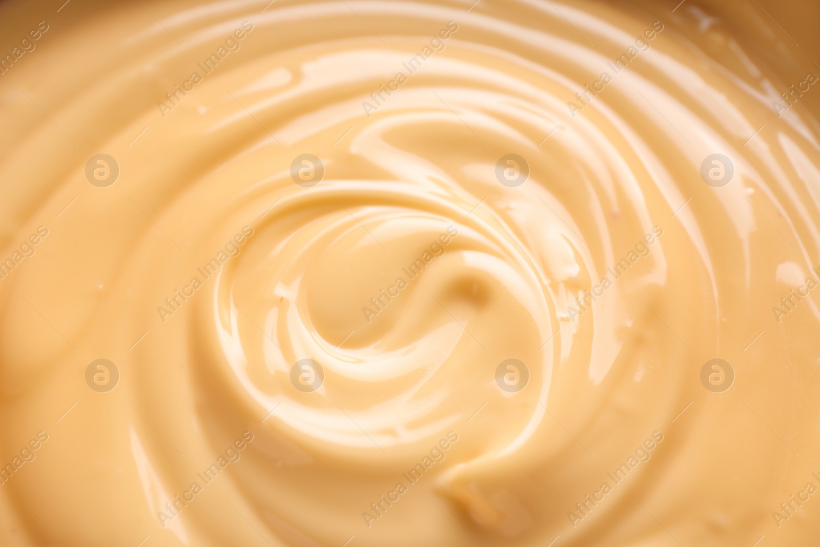 Photo of Delicious cheese fondue as background, closeup view