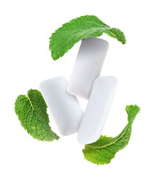 Image of Fresh mint leaves and chewing gum pads flying on white background