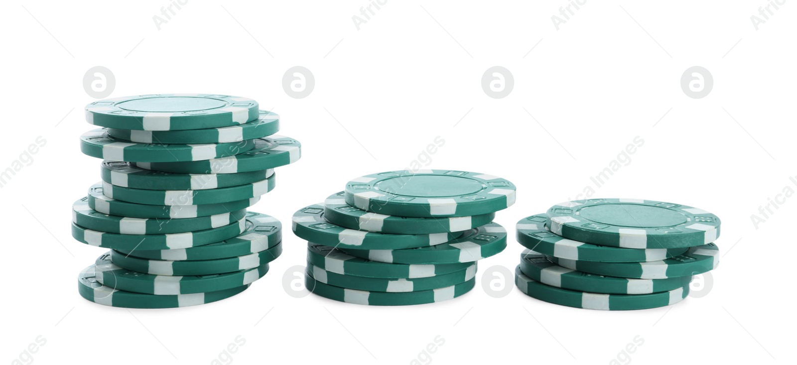 Photo of Stacks of casino poker chips on white background