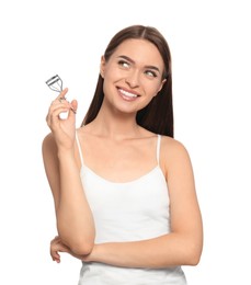 Woman with eyelash curler on white background