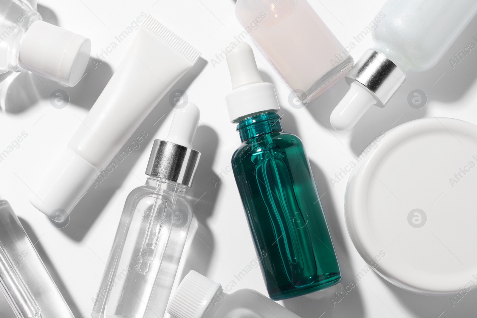 Photo of Cosmetic serum on white background, flat lay