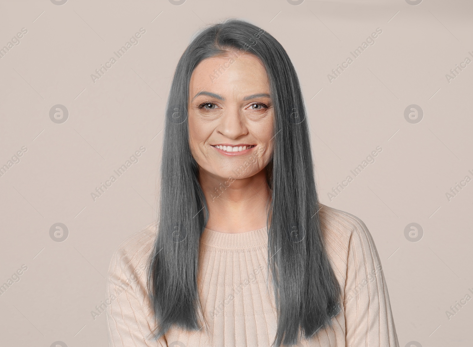 Image of Portrait of senior woman on light background