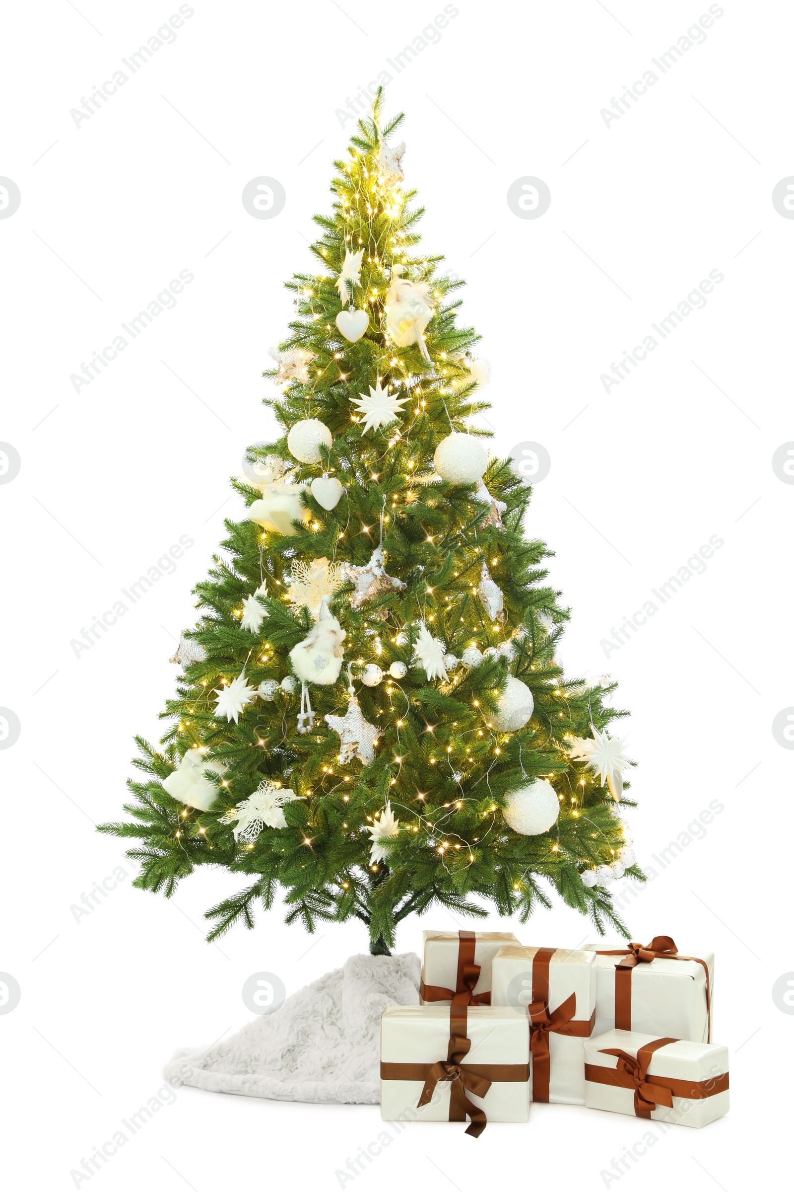 Photo of Decorated Christmas tree with faux fur skirt and gifts on white background