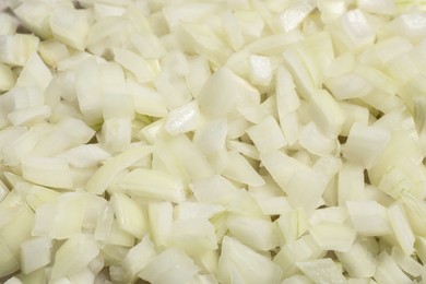 Fresh cut onion as background, closeup view