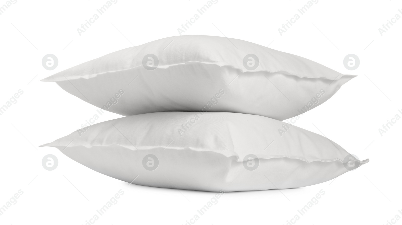 Photo of Two new soft pillows isolated on white