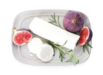 Photo of Delicious goat cheese with fresh figs and rosemary on white background, top view