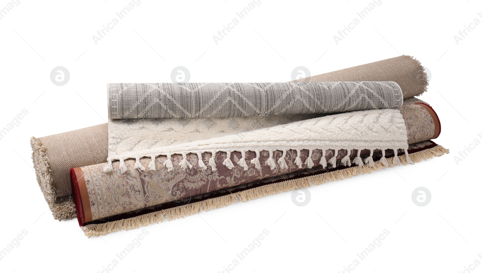 Photo of Rolled carpets on white background. Interior element