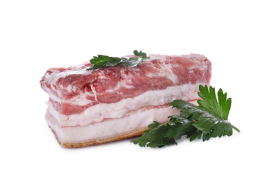 Photo of Piece of pork fatback and parsley isolated on white
