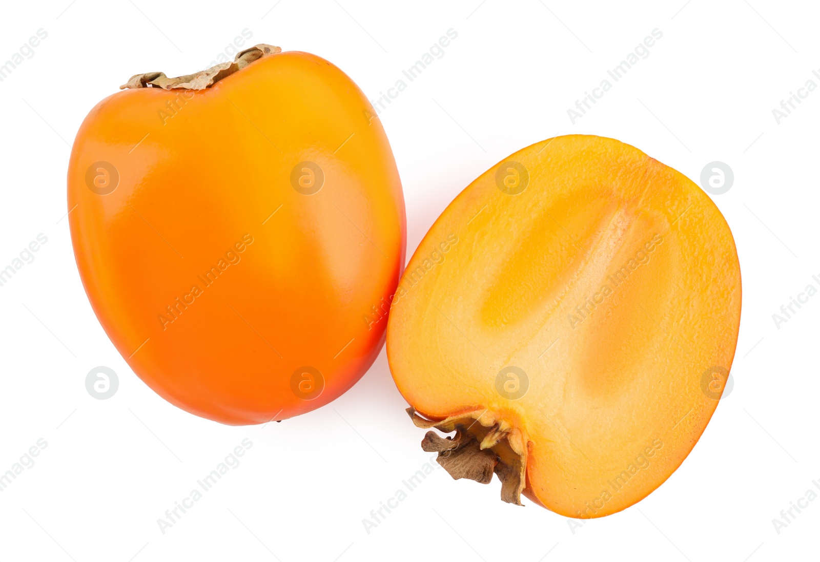 Photo of Whole and cut persimmon fruits isolated on white, top view