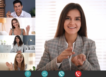 Image of Coworkers using video chat to work remotely. People on display, views through camera