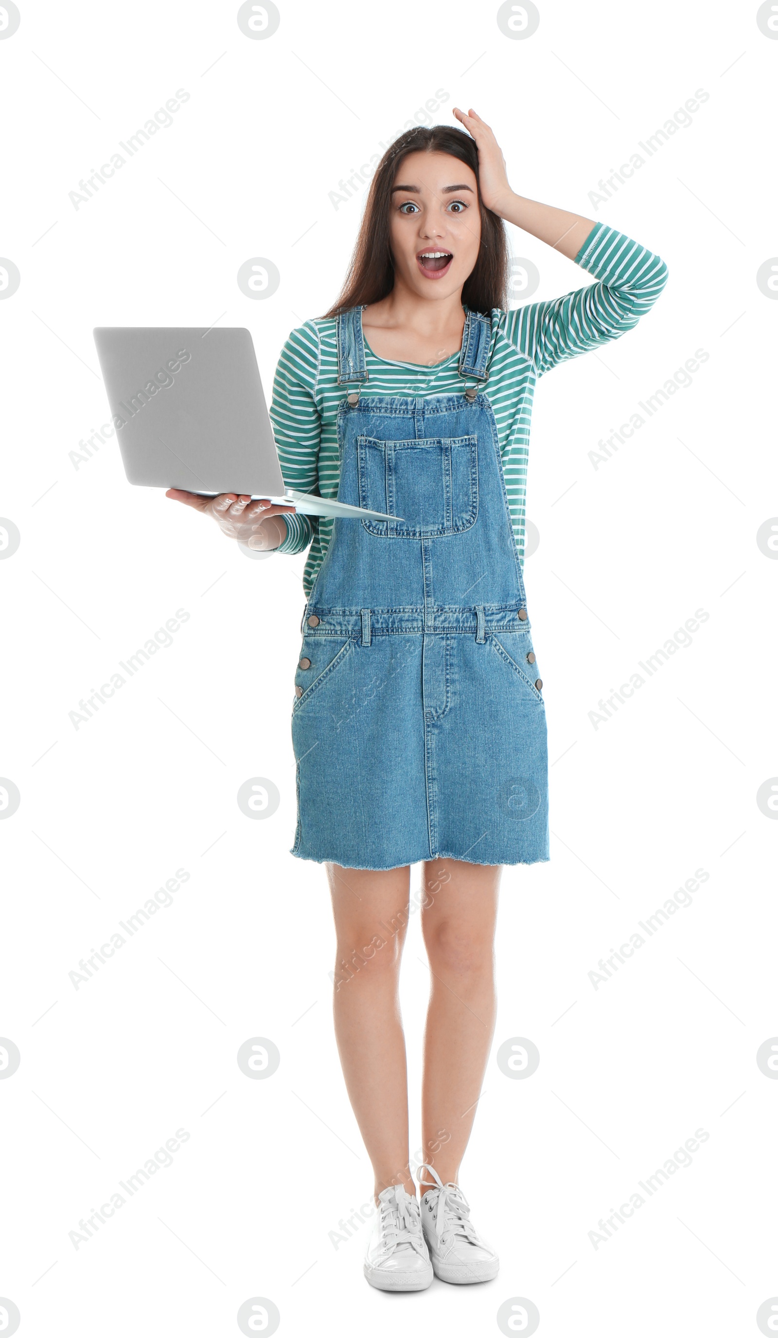 Photo of Full length portrait shocked of young woman in casual outfit with laptop on white background