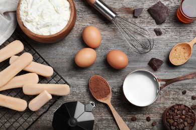 Flat lay composition with ingredients for tiramisu on wooden table