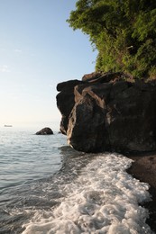 Photo of Picturesque view of sea and rocks on sunny day