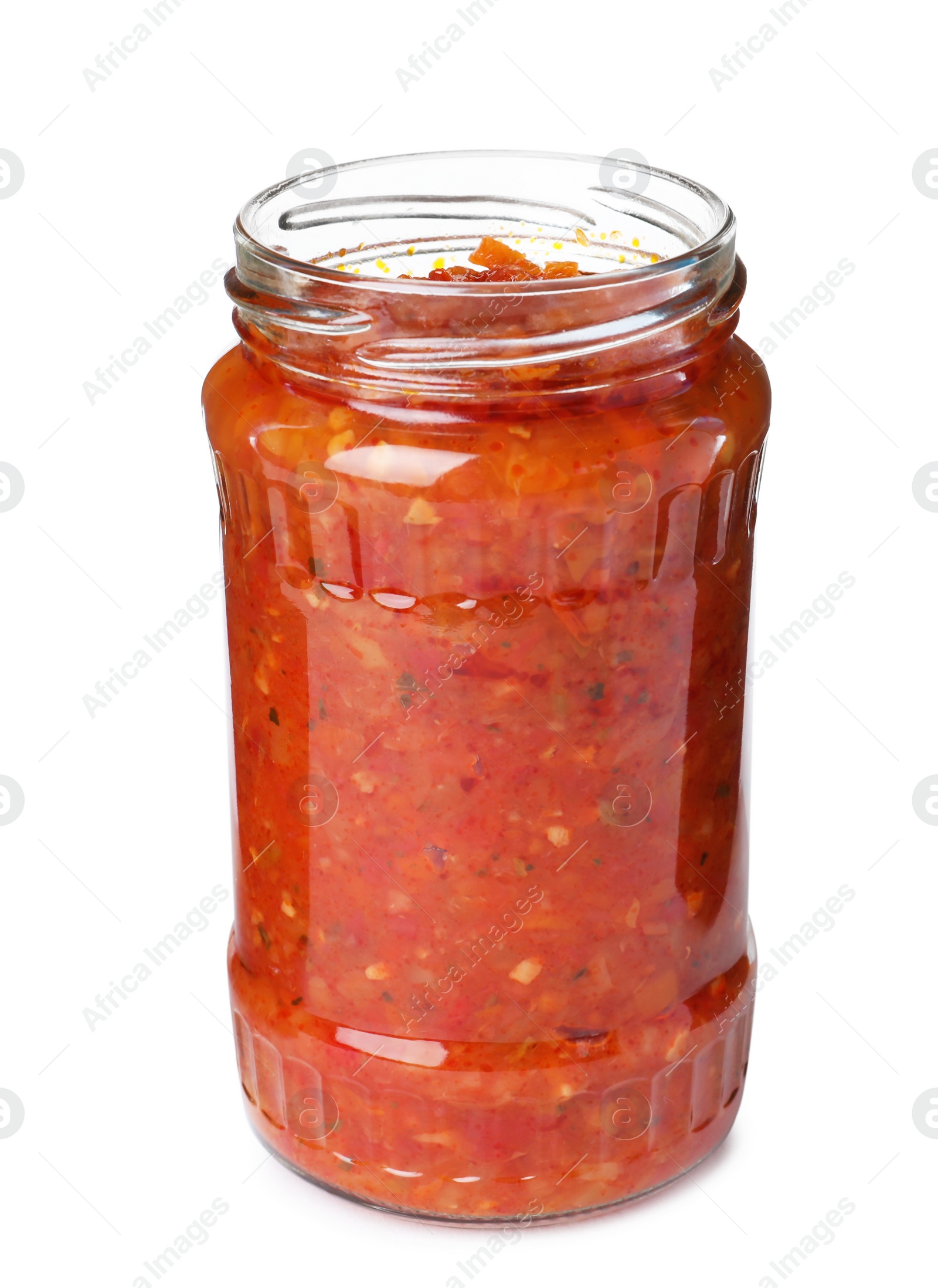 Photo of Glass jar with pickled red sauce isolated on white