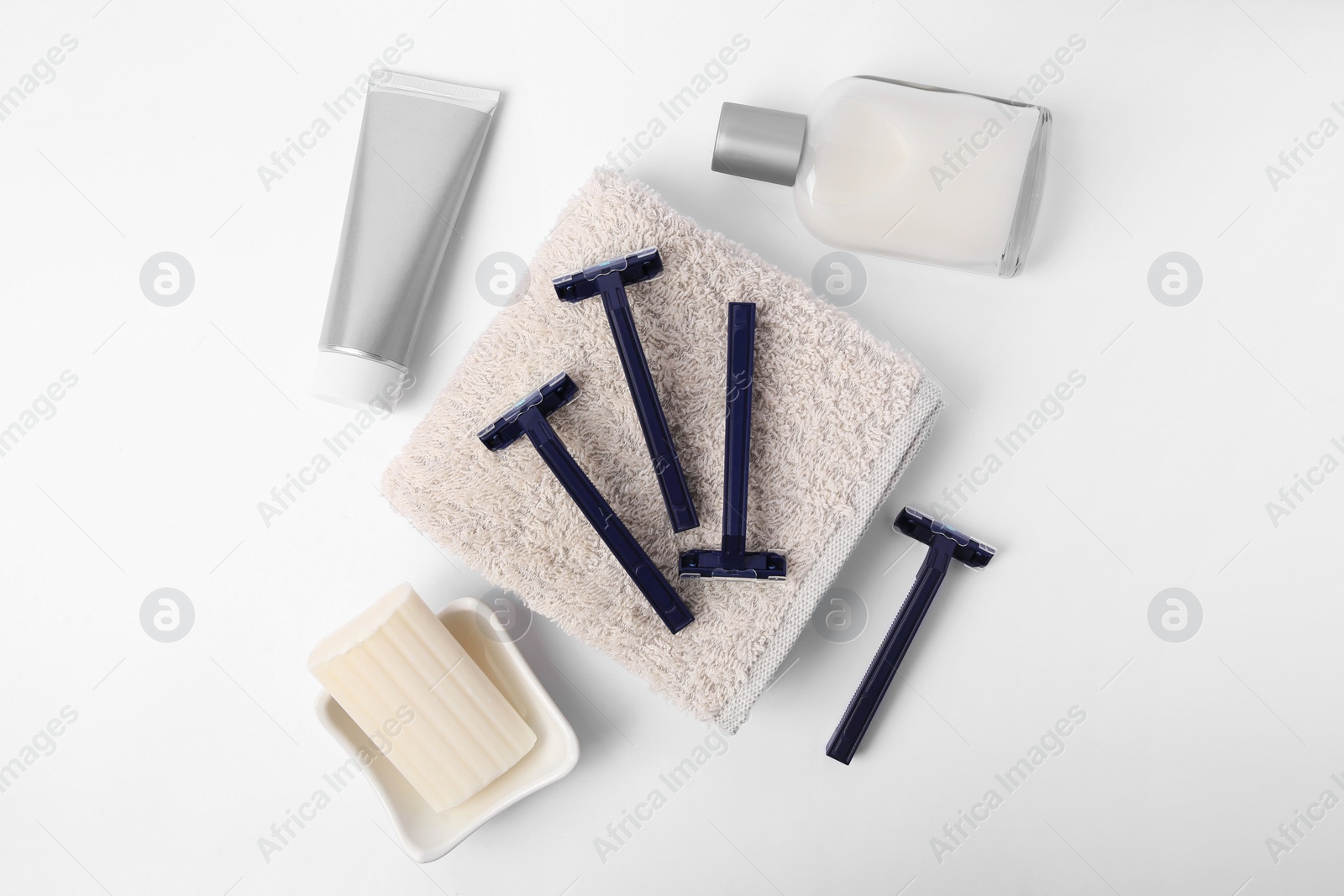 Photo of Different men's shaving accessories on white background, flat lay