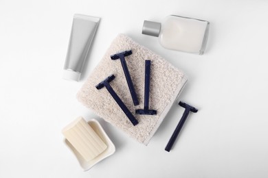 Photo of Different men's shaving accessories on white background, flat lay