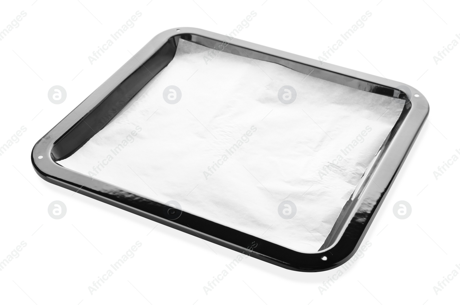 Photo of Baking pan with parchment paper isolated on white