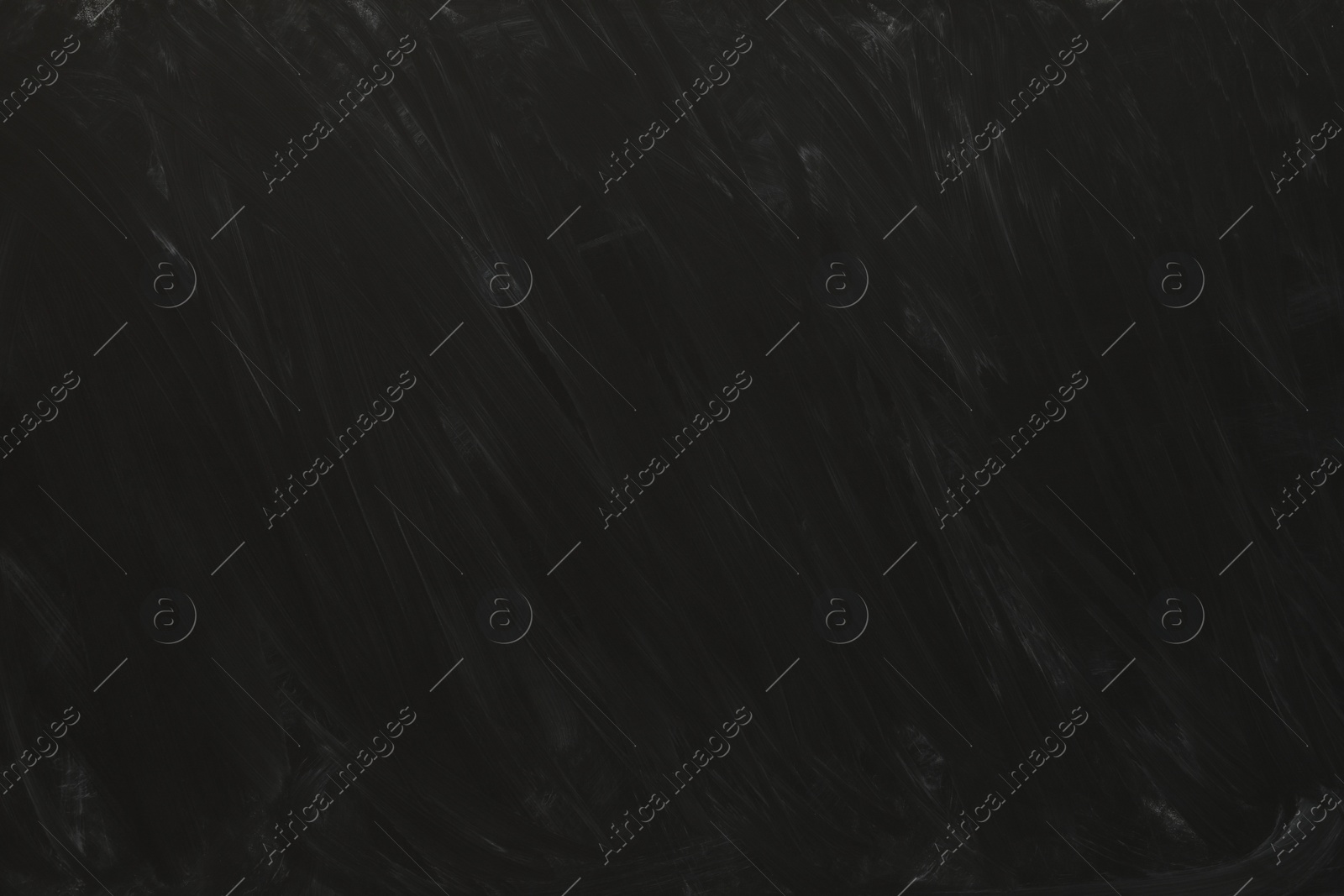 Photo of Dirty black chalkboard as background. School equipment