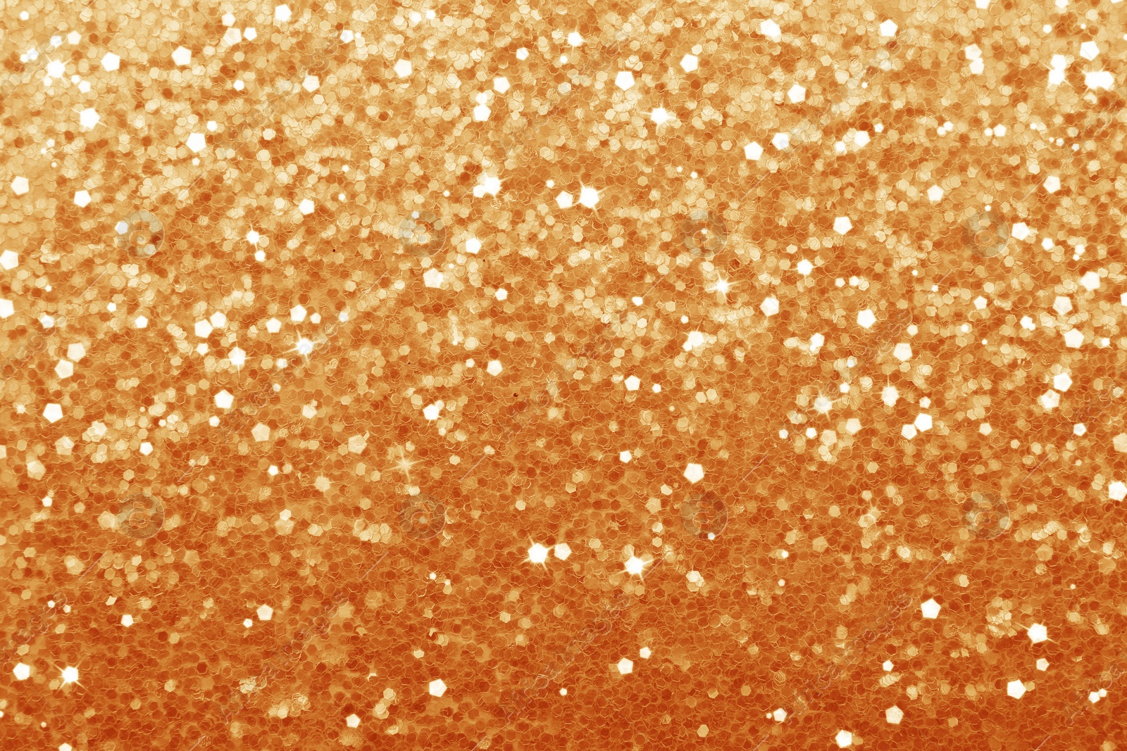 Image of Beautiful shiny orange glitter as background, closeup