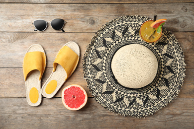 Beach objects on wooden background, flat lay