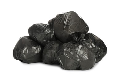 Black trash bags filled with garbage on white background