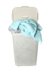 Plastic laundry basket full of clothes isolated on white