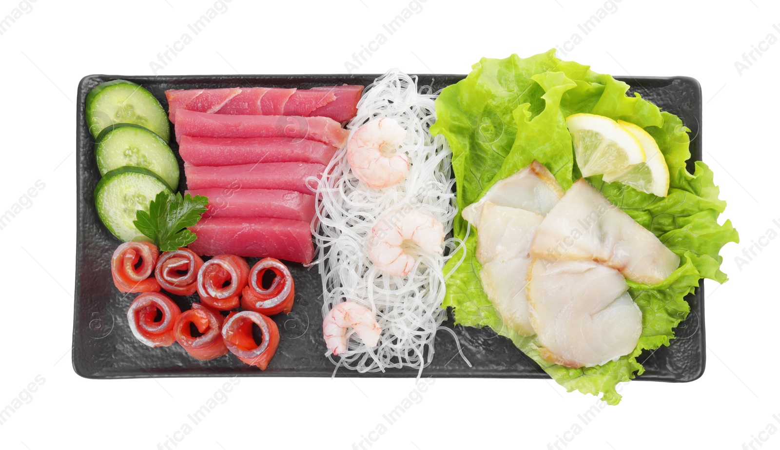 Photo of Sashimi set (raw slices of tuna, salmon, oily fish and shrimps) served with cucumber, lettuce, funchosa and lemon isolated on white, top view