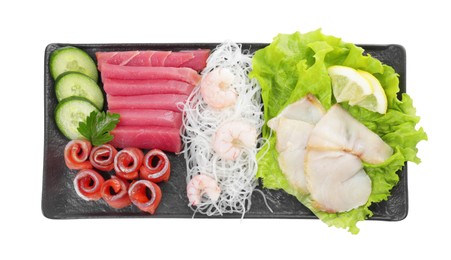 Sashimi set (raw slices of tuna, salmon, oily fish and shrimps) served with cucumber, lettuce, funchosa and lemon isolated on white, top view
