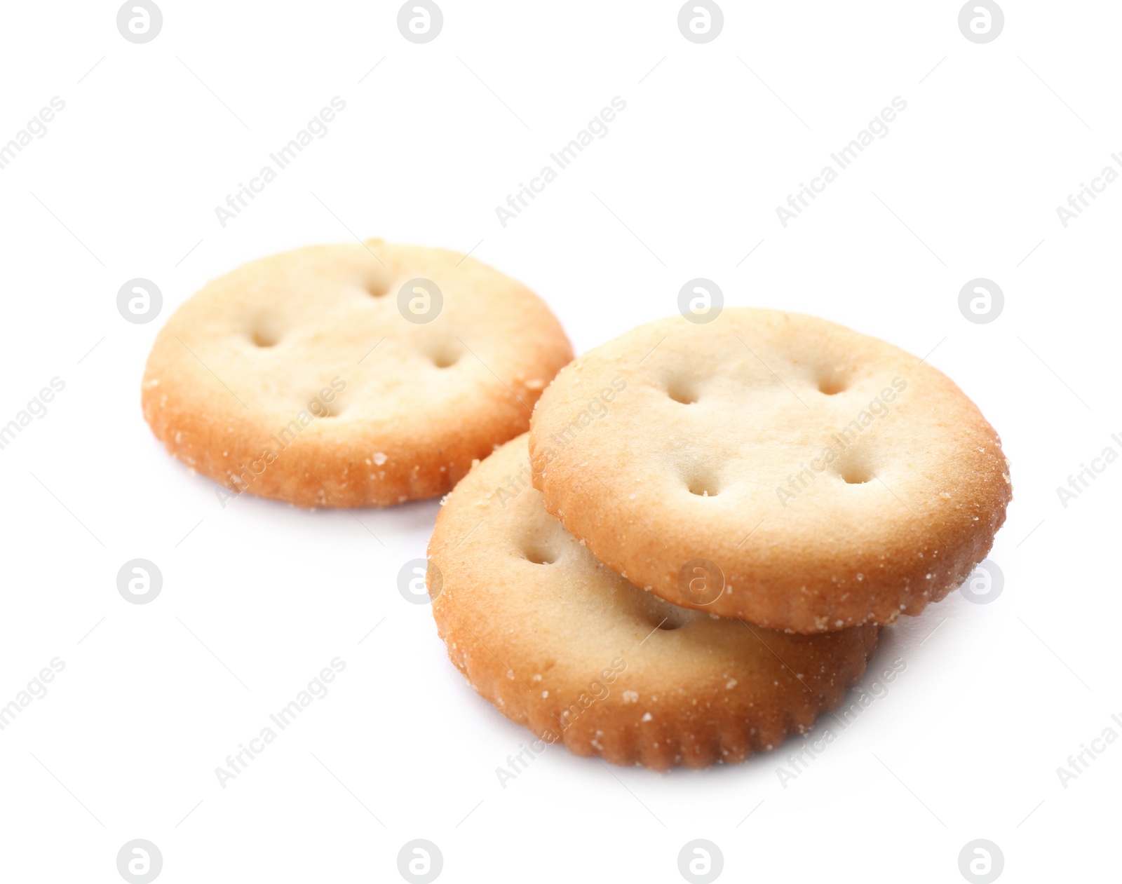 Photo of Crispy crackers isolated on white. Delicious snack