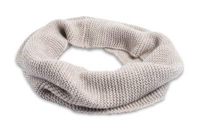 One beige knitted scarf on white background