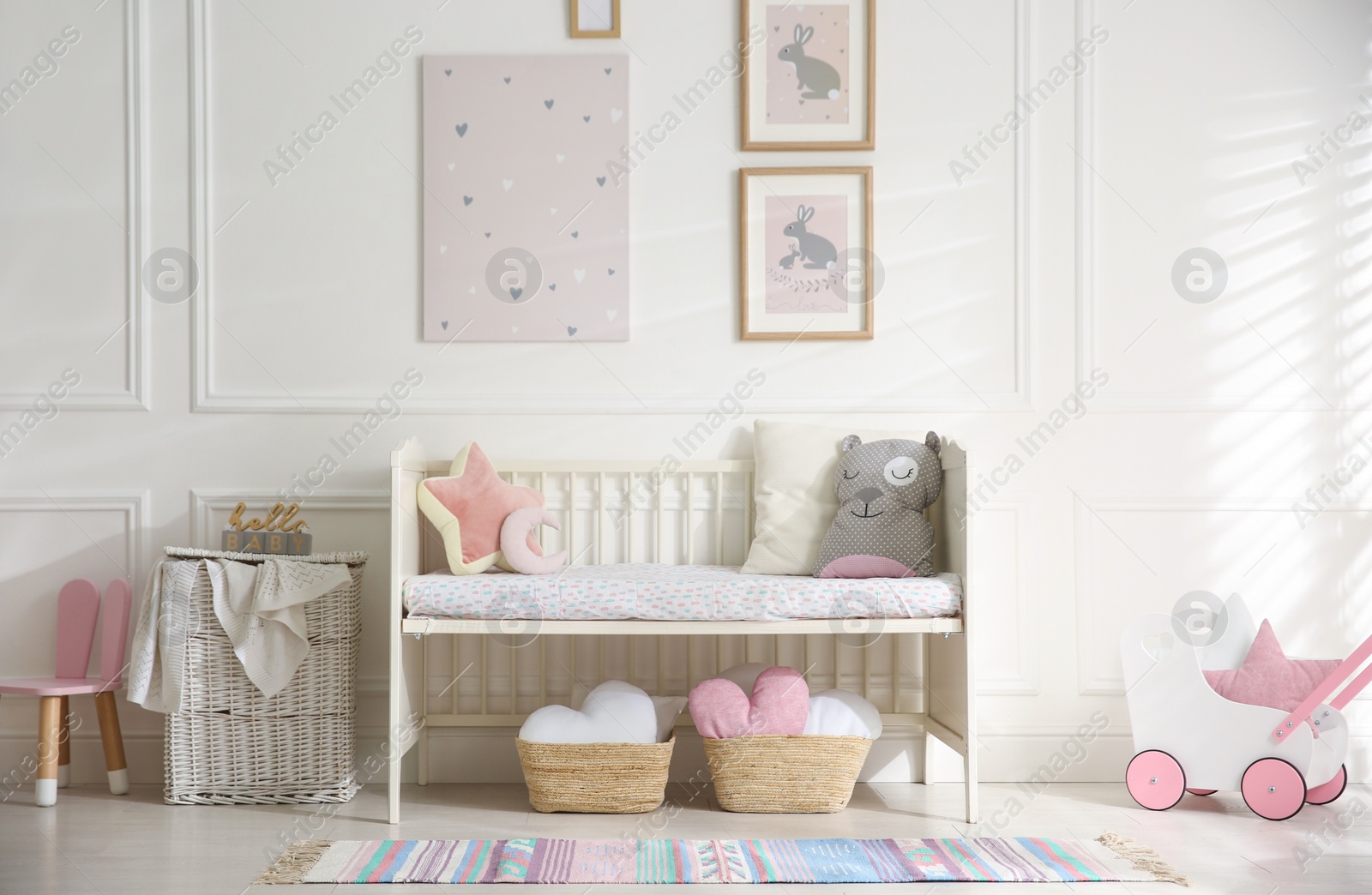 Photo of Baby room interior with stylish furniture and toys