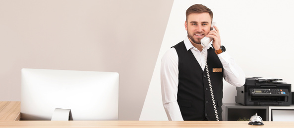 Receptionist talking on telephone at desk in modern hotel. Banner design