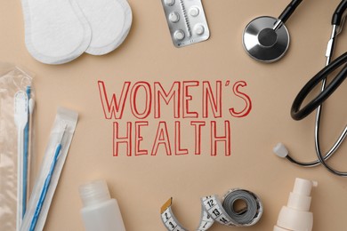 Photo of Flat lay composition with sanitary pads, pills near words Women's Health on beige background