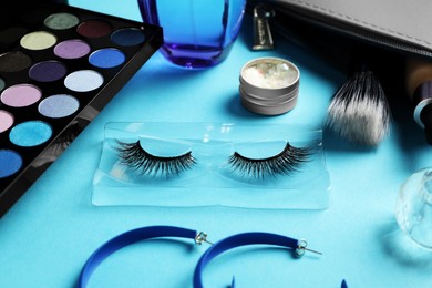 Photo of Set of makeup products on light blue background