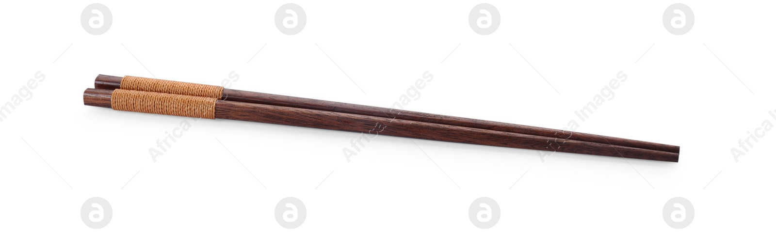 Photo of Pair of wooden chopsticks isolated on white