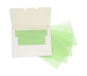 Package with facial oil blotting tissues on white background, top view. Mattifying wipes