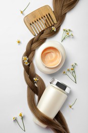 Photo of Flat lay composition with natural cosmetic products and hair braid on white background