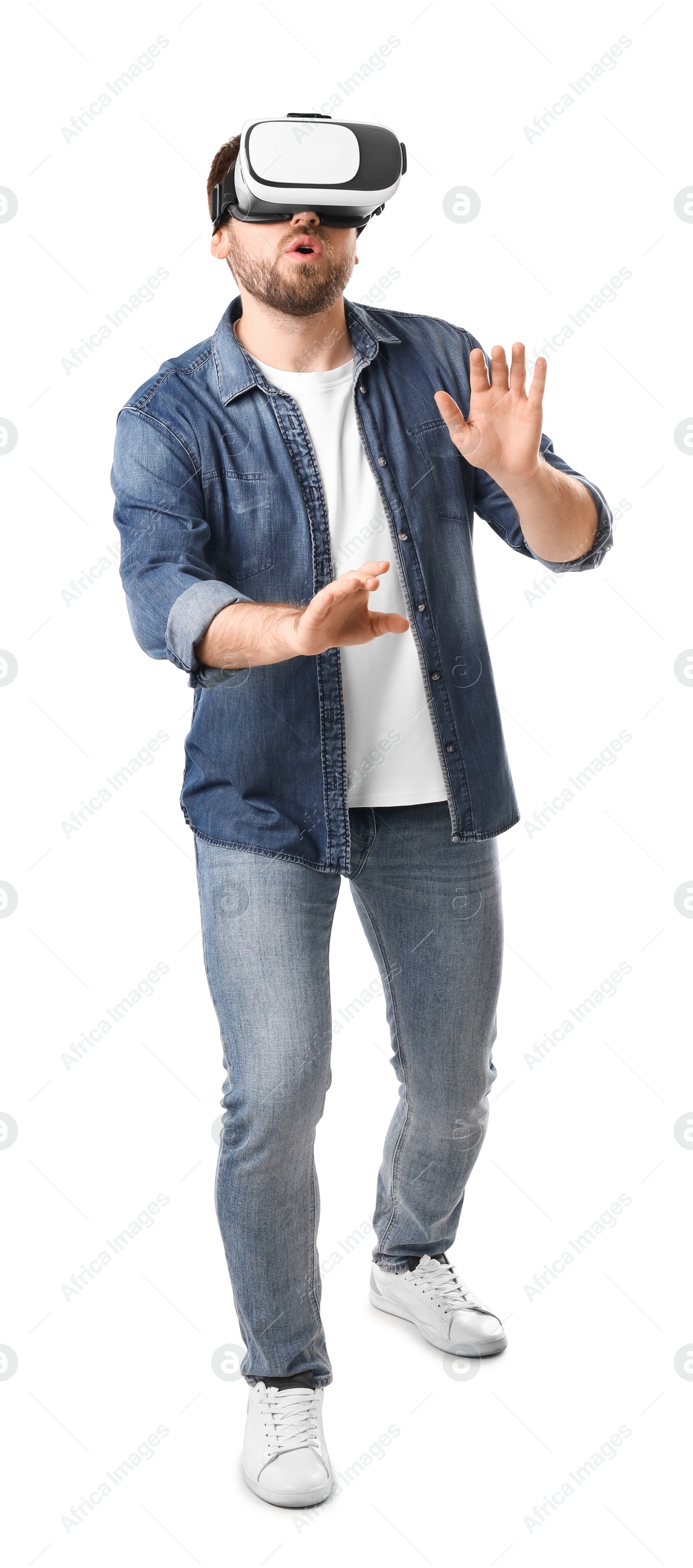 Photo of Man using virtual reality headset on white background