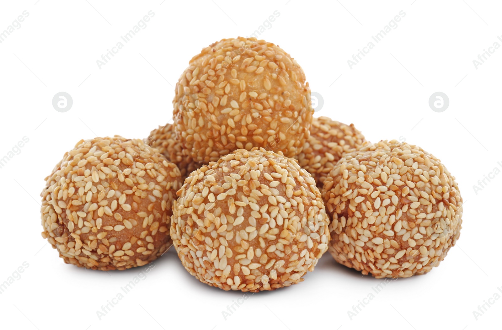 Photo of Many delicious sesame balls on white background