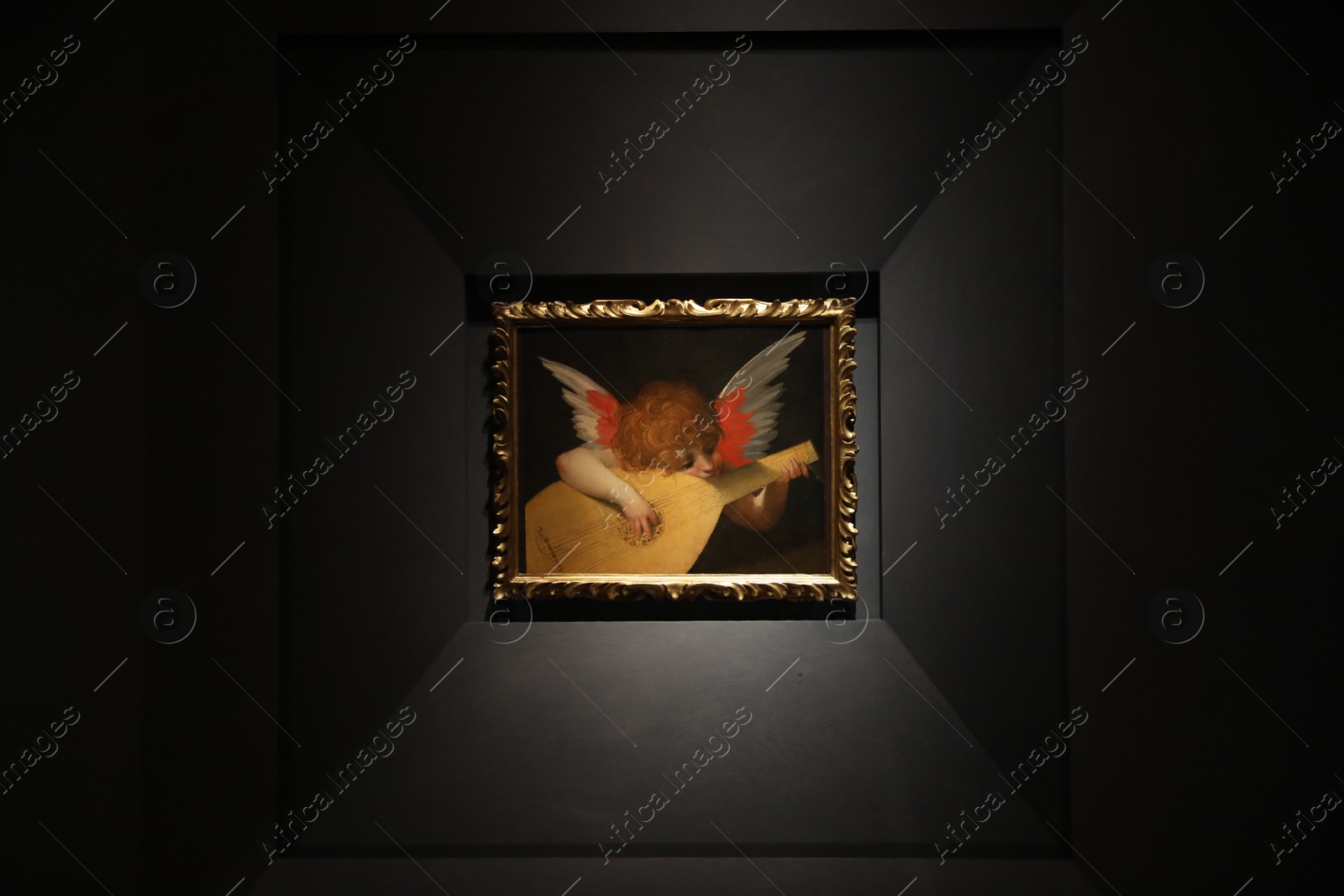 Photo of Florence, Italy - February 8, 2024: Famous painting "Angel Musician" by Rosso Fiorentino at Uffizi gallery