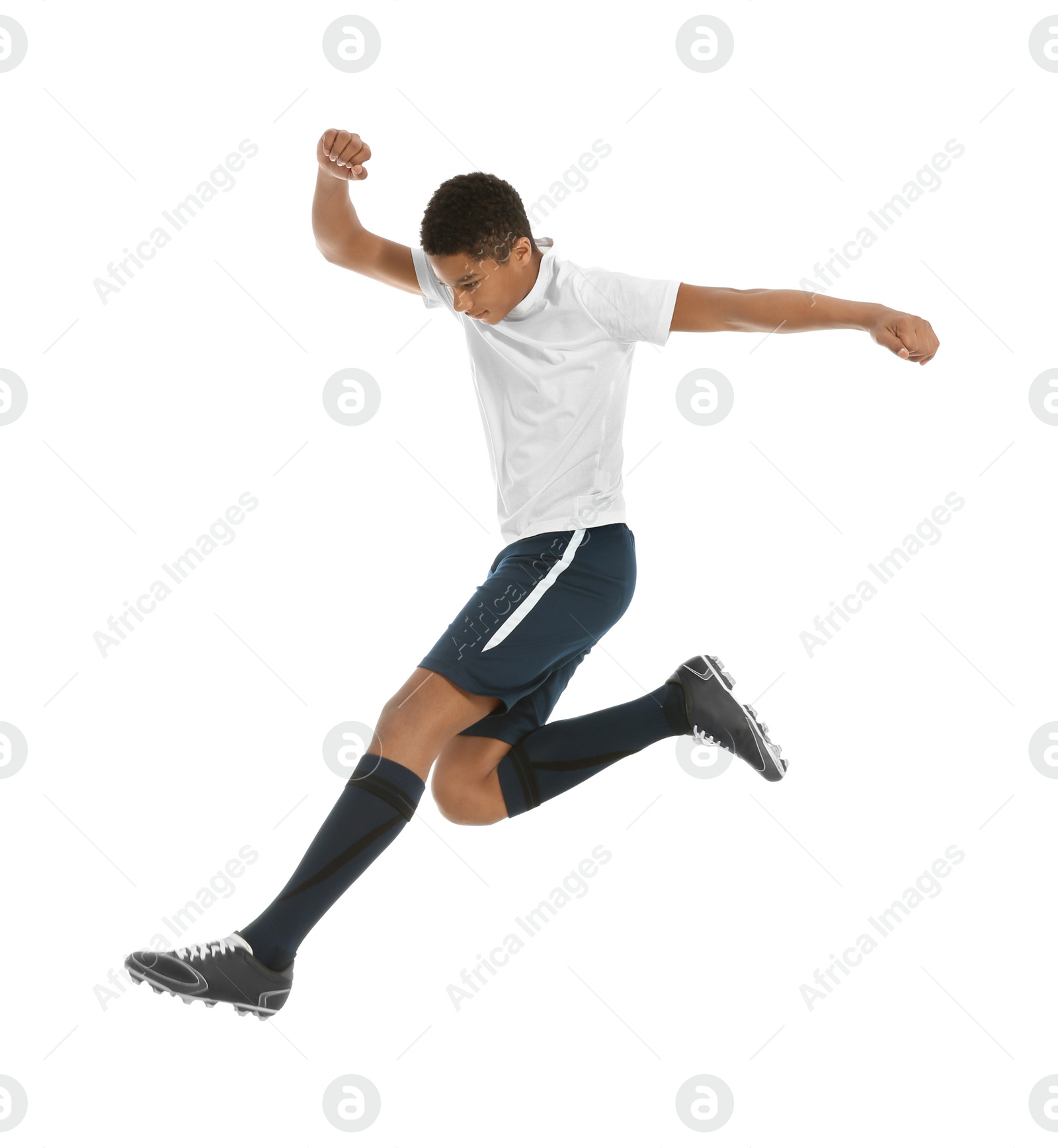 Photo of Teenage African-American boy playing football on white background