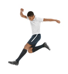 Teenage African-American boy playing football on white background