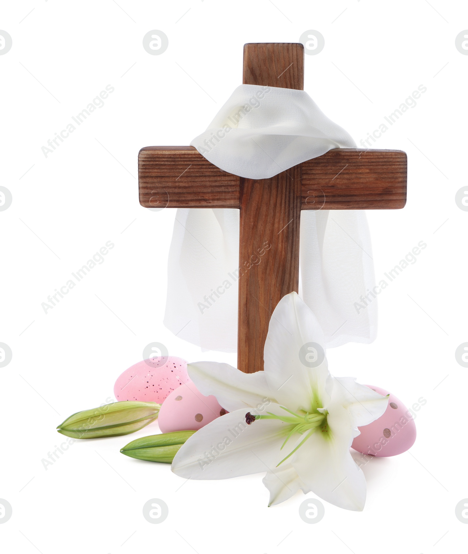 Photo of Wooden cross, cloth, painted Easter eggs and lily flowers on white background
