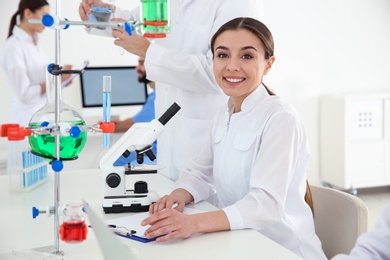 Medical student working at table in scientific laboratory