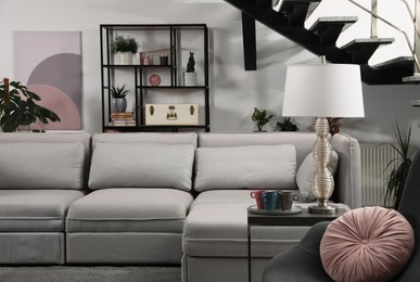 Photo of Stylish living room interior with comfortable sofa