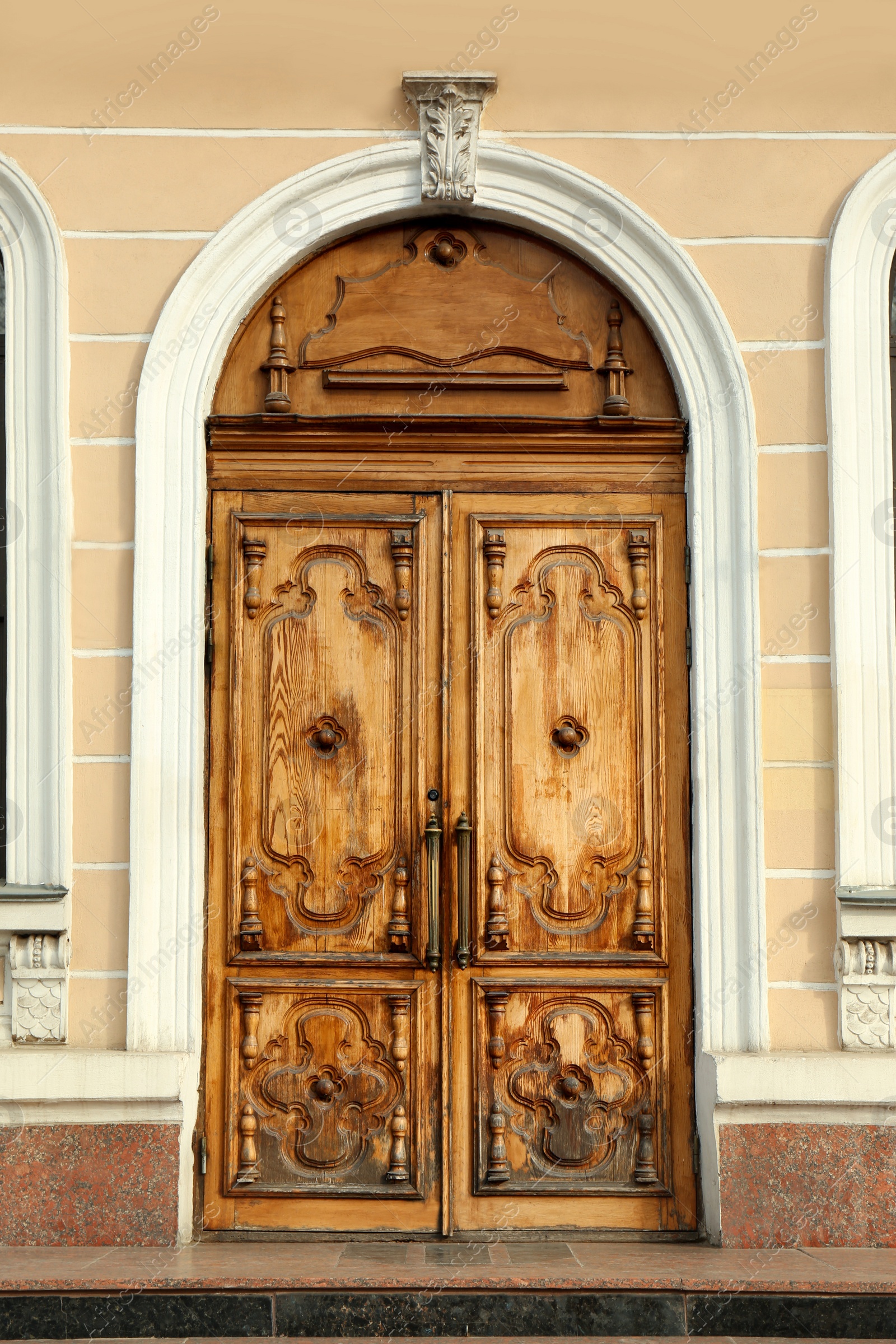 Photo of Closed vintage wooden door in old building