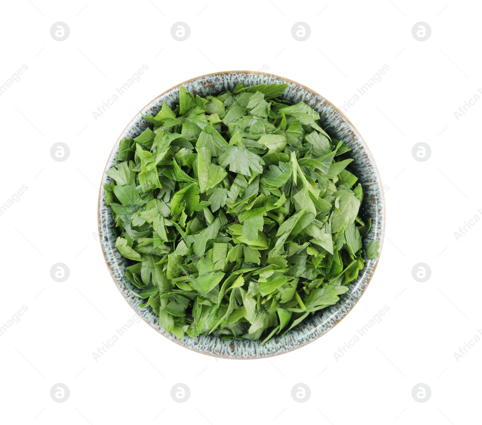 Chopped parsley leaves in bowl isolated on white, top view Photo of Chopped parsley leaves in bowl isolated on white, top view